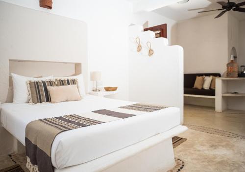 Ένα ή περισσότερα κρεβάτια σε δωμάτιο στο Villa Los Mangles Boutique Hotel