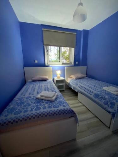 Ένα ή περισσότερα κρεβάτια σε δωμάτιο στο Ionian Blue View
