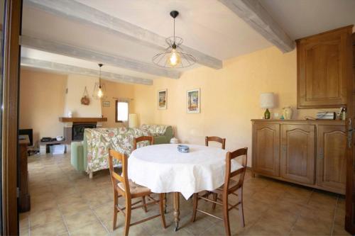 a kitchen and dining room with a table and chairs at Large Spacious House In Fréjus in Fréjus