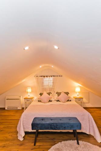 a bedroom with a large bed with two night stands at Villa Kate -with private pool and BBQ in Brusje