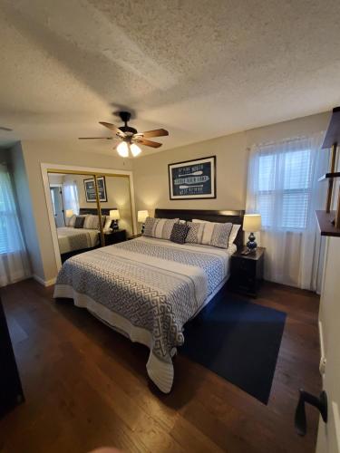 a bedroom with a bed and a ceiling fan at Treehouse Condos - Branson in Branson