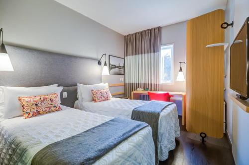 Postel nebo postele na pokoji v ubytování Rio Hotel by Bourbon Indaiatuba