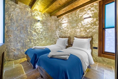 Katil atau katil-katil dalam bilik di Marisstone Hotels