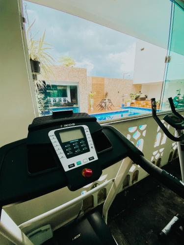 a scale in a room with a swimming pool at Hotel Antiga Roma in Belém