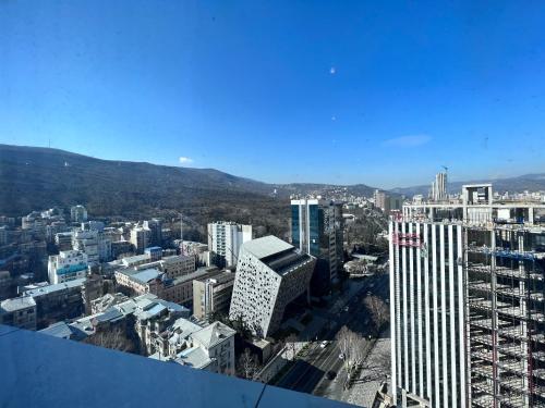 a view of a city from the top of a building at Apartment in AXIS TOWERS, Tbilisi business center in Tbilisi City