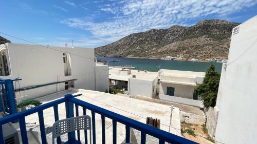 a balcony with a view of a body of water at Meropi Rooms in Kamares