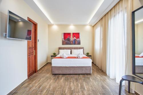 Postel nebo postele na pokoji v ubytování LP Luxury Suite - Old Town Xanthi