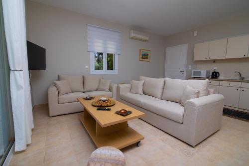 a living room with a couch and a table at Sunset Resort in Aiándion