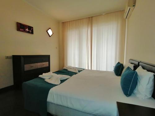Ένα ή περισσότερα κρεβάτια σε δωμάτιο στο Bendita Mare Apartment
