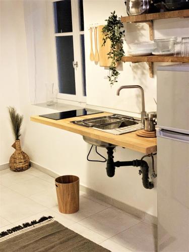 a kitchen with a sink and a counter at Martha III in Amaliás