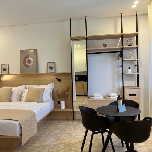 Ένα ή περισσότερα κρεβάτια σε δωμάτιο στο Zaro Apartments