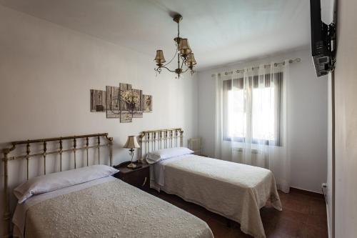 Postel nebo postele na pokoji v ubytování Casa Rural La Fontanita