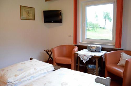 a hospital room with a bed and a window at Frühstückspension Pachler in Gosau