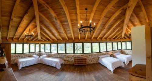 Ένα ή περισσότερα κρεβάτια σε δωμάτιο στο Casa Rural Alvarado