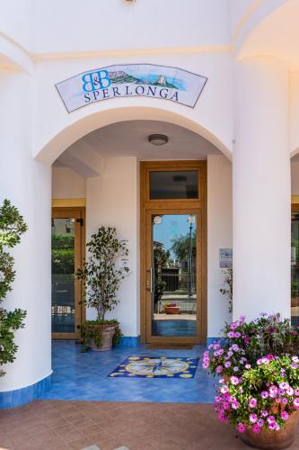 a entrance to a building with a sign that reads se reflex london at B&B Sperlonga in Sperlonga
