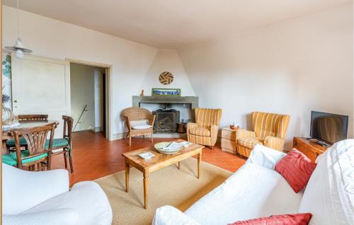 a living room with a couch and a table at 2 Bedroom Lovely Home In Loro Ciuffenna in Loro Ciuffenna