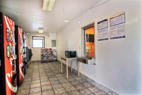 a store aisle with soda machines in a store at Motel 6-Lubbock, TX in Lubbock