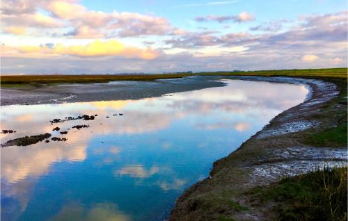 a river with a reflection of the sky in the water at Calimero in Sint Annaland