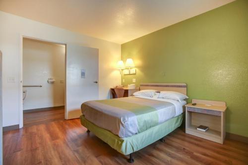 a hotel room with a bed and a bathroom at Motel 6-Elkton, MD in Elkton