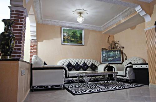a living room with a couch and a table at Naima house / دار نعيمة in Taroudant