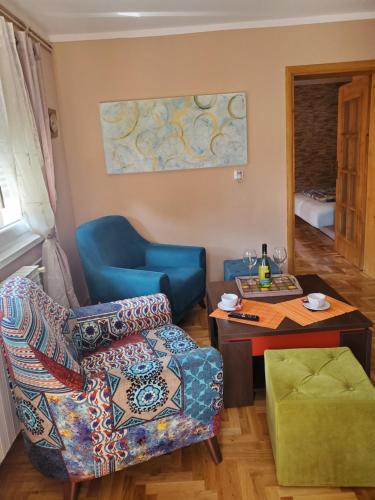 a living room with a couch and a table at Mimi appartman in Doboj