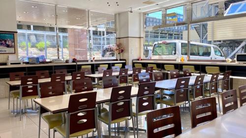 a classroom with tables and chairs in a building at Toyoko Inn Gifu-hashima-eki Shinkansen Minami-guchi in Hashima