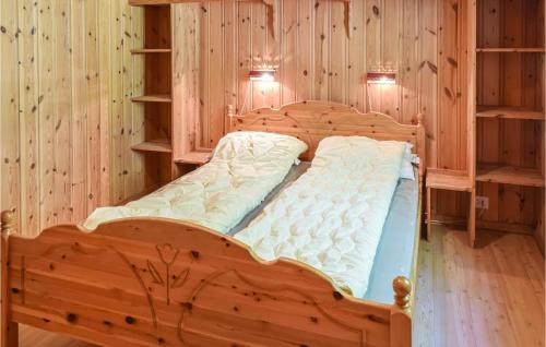 En eller flere senge i et værelse på Bjertnes Turistgrd
