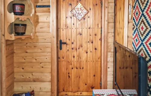 a door in a log cabin with at Stunning Home In Uvdal With Wifi in Uvdal