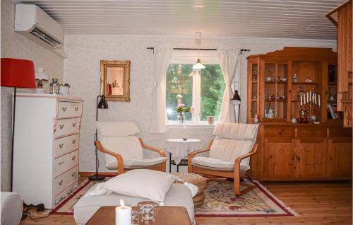 a living room with two chairs and a window at Pet Friendly Home In Rydaholm With Wifi in Rydaholm