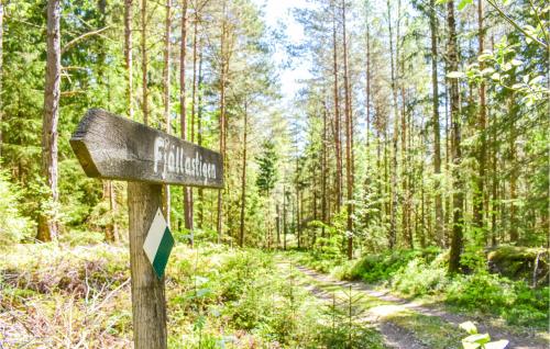 a sign on a trail in a forest at Gorgeous Home In Mollaryd With Wifi in Mollaryd