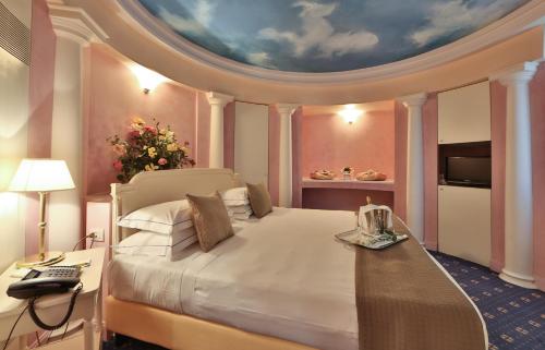 Ένα ή περισσότερα κρεβάτια σε δωμάτιο στο Hotel San Marco & Formula Club