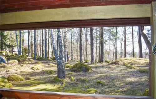 a view of a forest through a window at 3 Bedroom Gorgeous Home In Skärblacka in Skärblacka