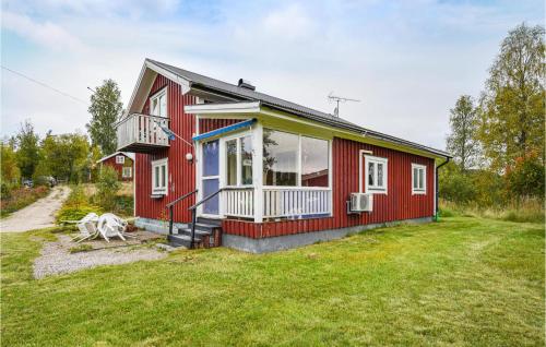 a red house with a large yard at 2 Bedroom Pet Friendly Home In Ekshärad in Ekshärad