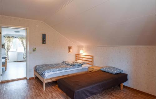 two beds in a room with two beds sidx sidx sidx sidx at 2 Bedroom Pet Friendly Home In Ekshärad in Ekshärad