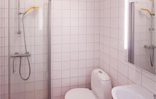 a bathroom with a shower and a toilet and a sink at 3 Bedroom Awesome Home In Arvika in Arvika