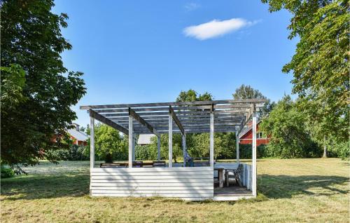 a gazebo in a field with trees at Cozy Home In Klockrike With Wifi in Klockrike