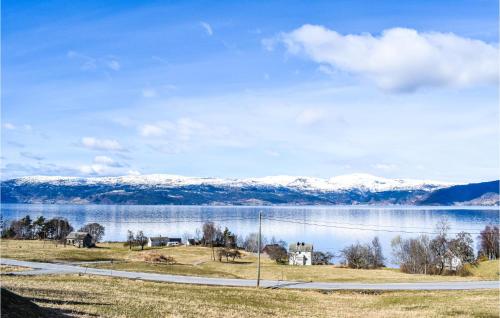 a view of a lake with snow covered mountains at 3 Bedroom Lovely Home In Kysnesstrand in Gausvik