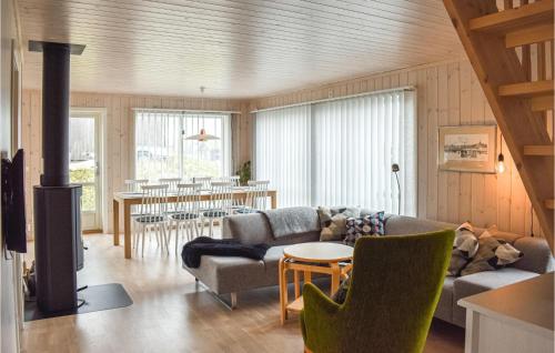 a living room with a couch and a table at Awesome Home In yer With House A Mountain View in Øyer