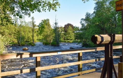 a view of a river from a fence at 4 Bedroom Lovely Home In Näsum in Näsum