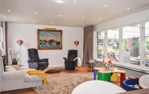 a living room with a couch and chairs at Nice Home In Höganäs With Wifi in Höganäs
