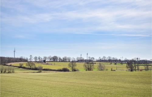 a field of green grass with a blue sky at 2 Bedroom Beautiful Home In Söderåkra in Söderåkra