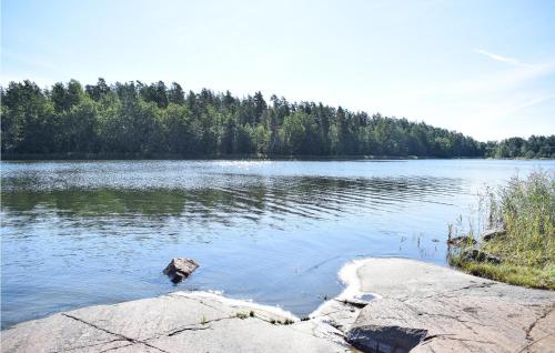 a large body of water with trees in the background at 2 Bedroom Pet Friendly Home In Figeholm in Figeholm