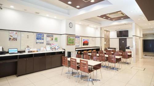 a classroom with desks and chairs in a room at Toyoko Inn Nagoya Nishiki in Nagoya