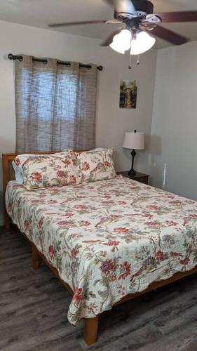 a bedroom with a bed and a ceiling fan at Mimi's Cabin in Squaw Valley