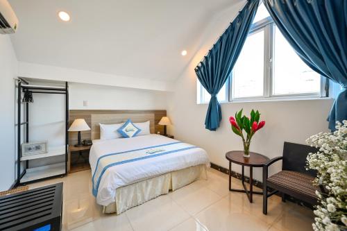 En eller flere senge i et værelse på Laguna Hotel