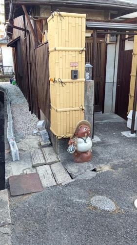 a stack of boxes sitting on the side of a building at Kyoto Osaka SUMIREYA in Takatuki