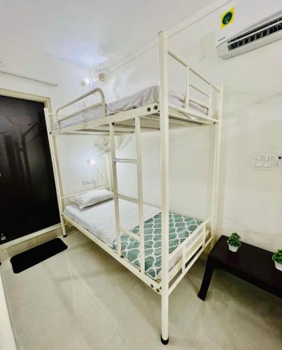 a bedroom with two bunk beds in a room at Hostel ivory in Jaipur