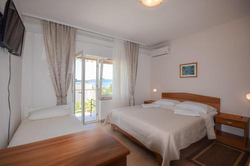 Łóżko lub łóżka w pokoju w obiekcie B&B villa IVONA