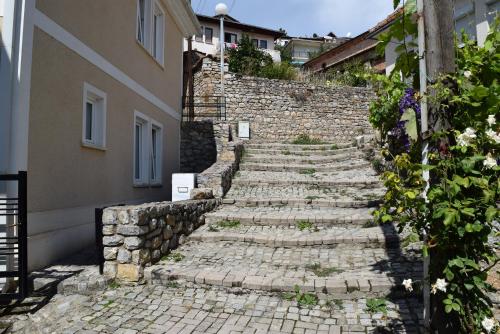 a stone staircase leading up to a building at Apartment and Studio Damjan in Ohrid