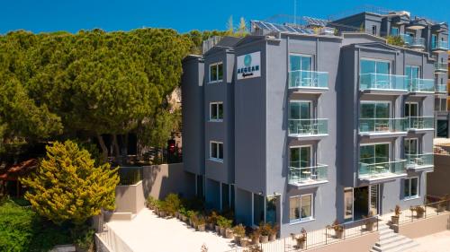 an aerial view of a building with trees at AEGEAN Apartments - Çeşme in Çeşme
